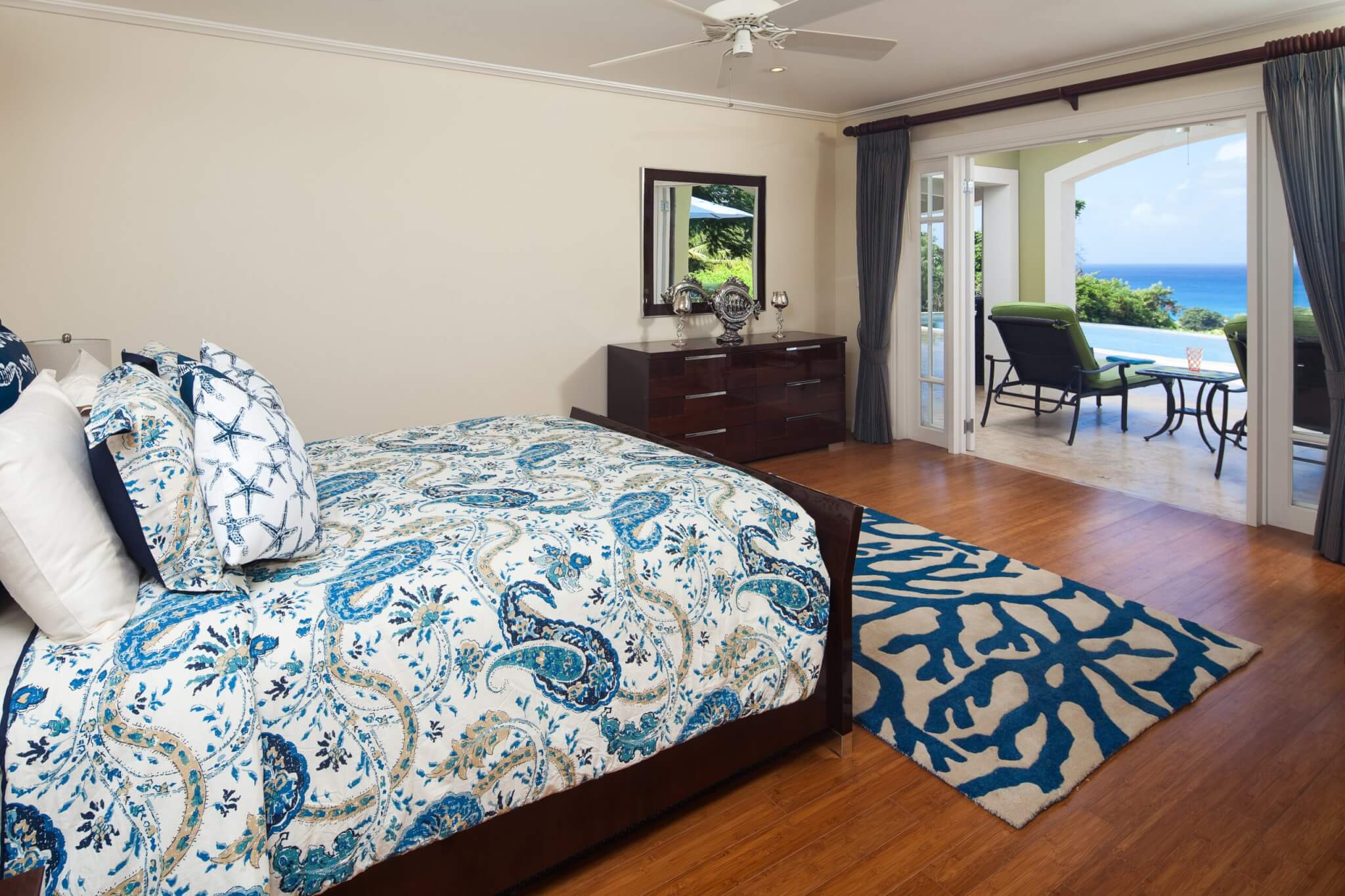 Monkey Hill at Sugar Hill bedroom with loungers on balcony looking out to sea