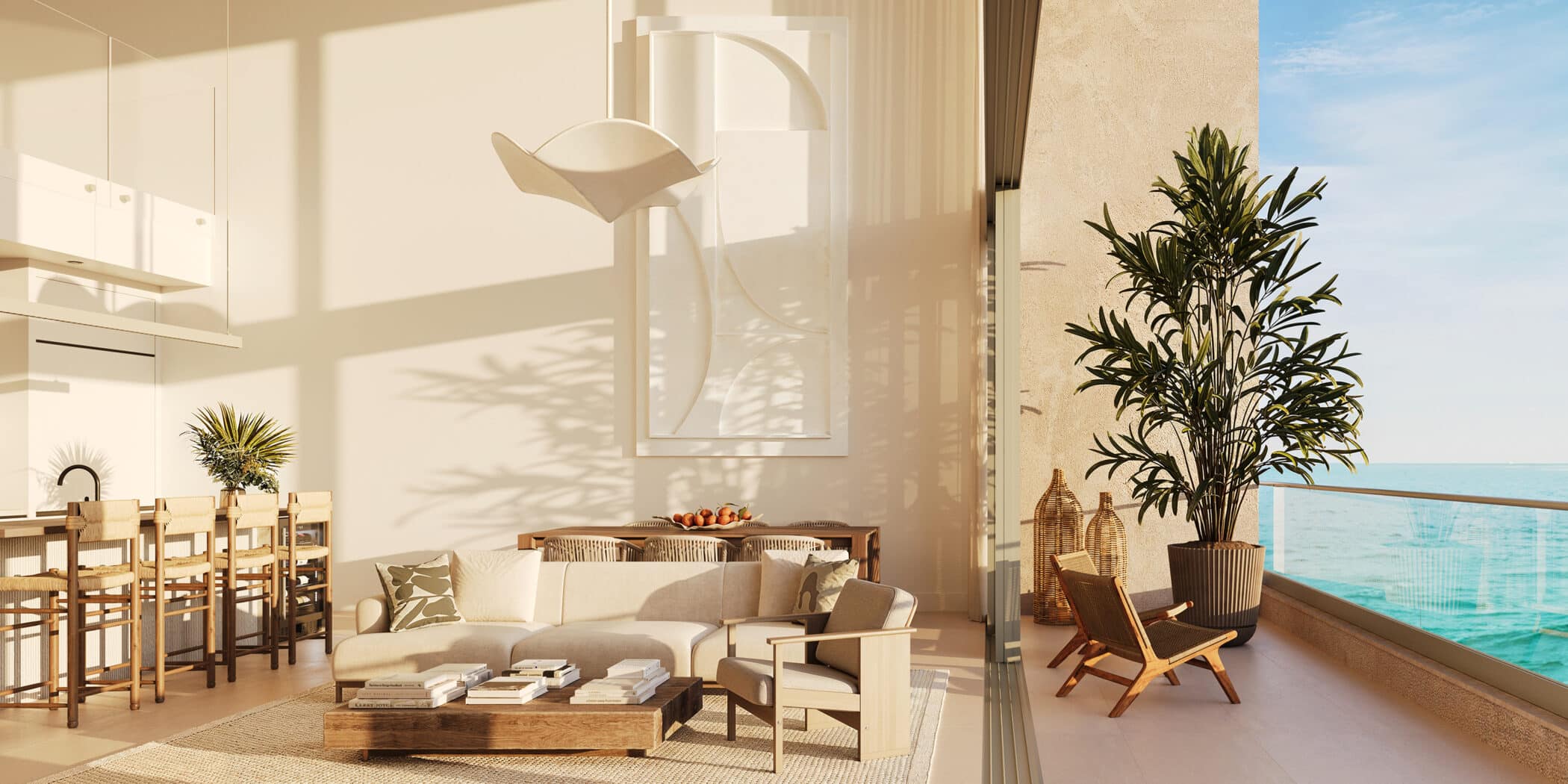 A modern, sunlit living room with neutral decor, light wood furniture, large potted plants, and an open balcony overlooking a calm, blue ocean. Dining area and kitchen are visible in the background.