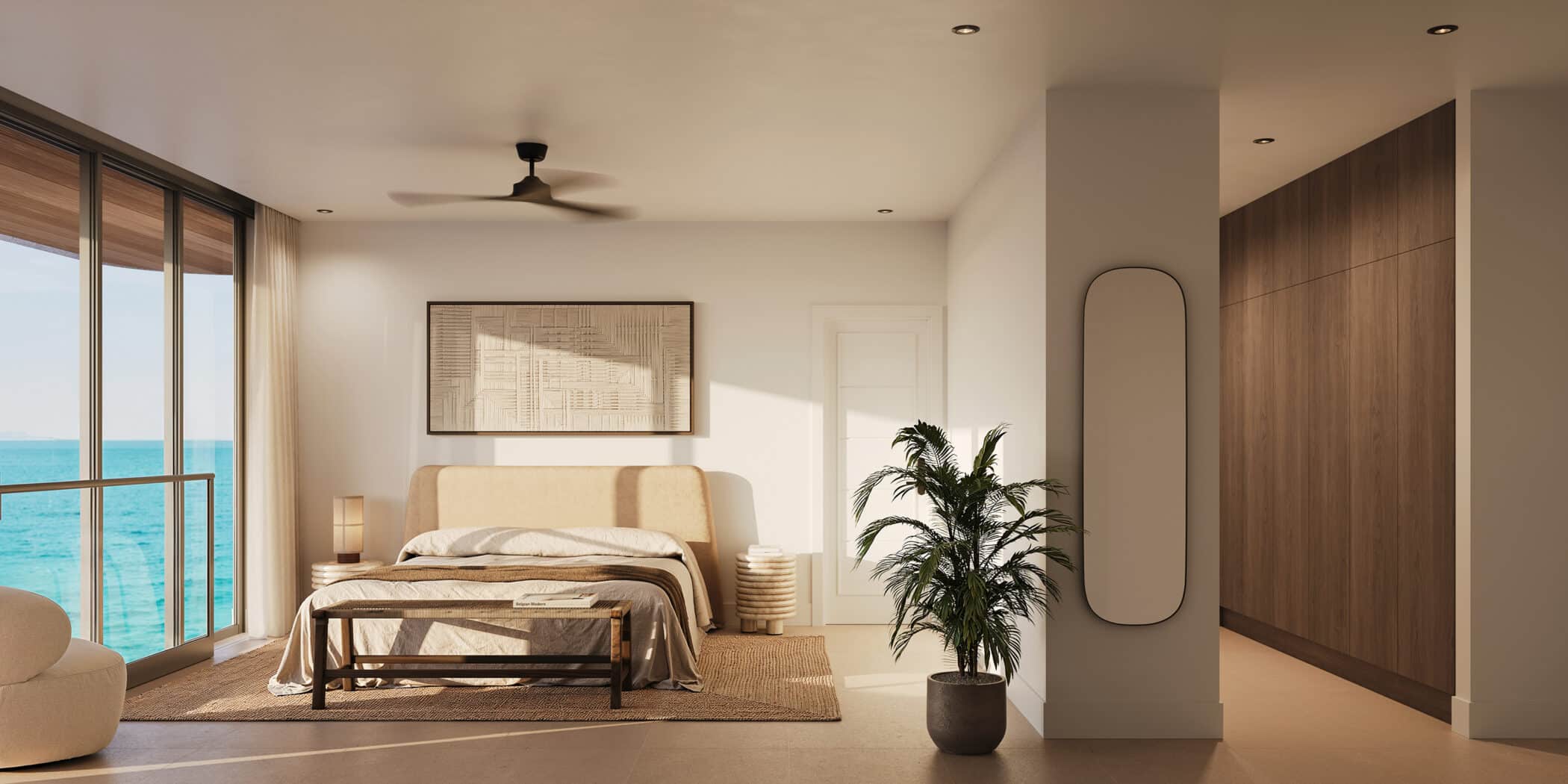 A modern bedroom with large windows overlooking the ocean, a beige bed, a potted plant, wooden accents, a ceiling fan, and natural light filling the space.